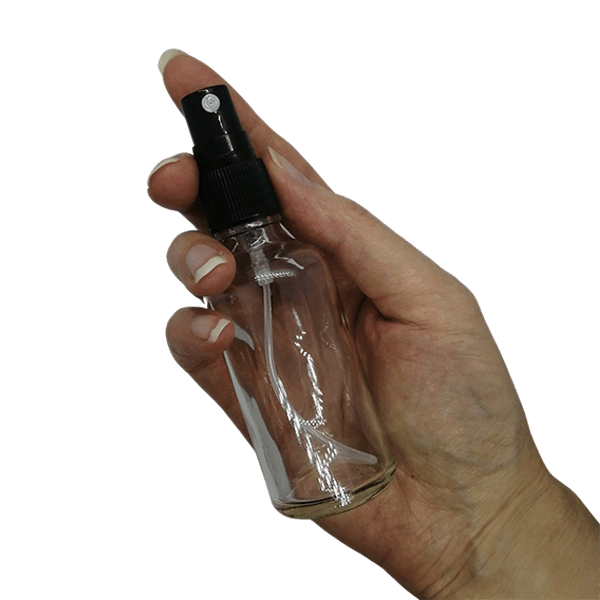 50ml clear glass bottle with black mister spray in hand