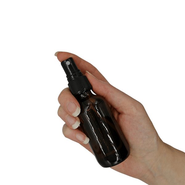 50ml Amber Glass Bottle with Black Mist Spray - holding