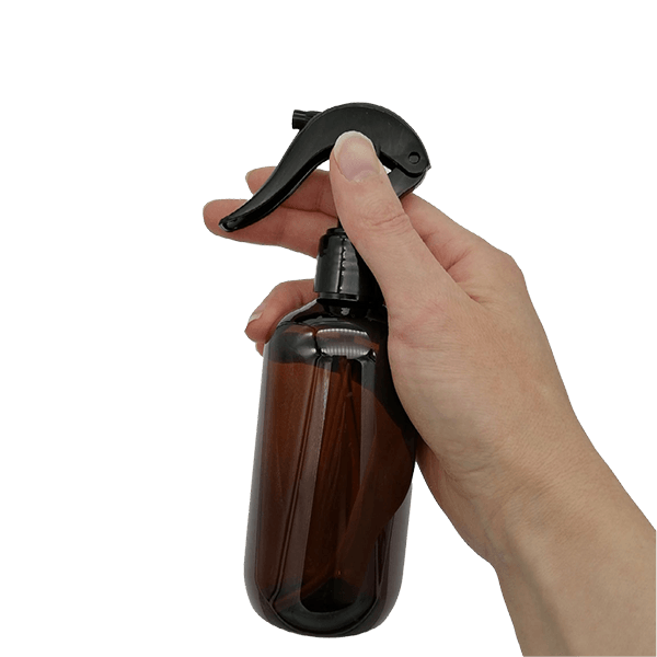 250ml Amber PET bottle with trigger spray in hand 2